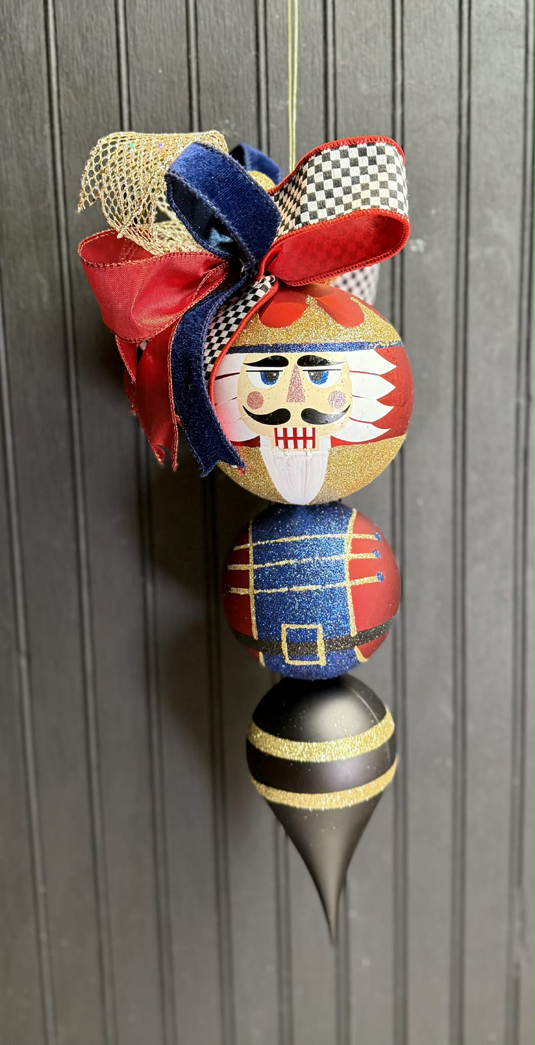 Nutcracker with Blue Check and Red, Blue and Gold Ribbon Ornament